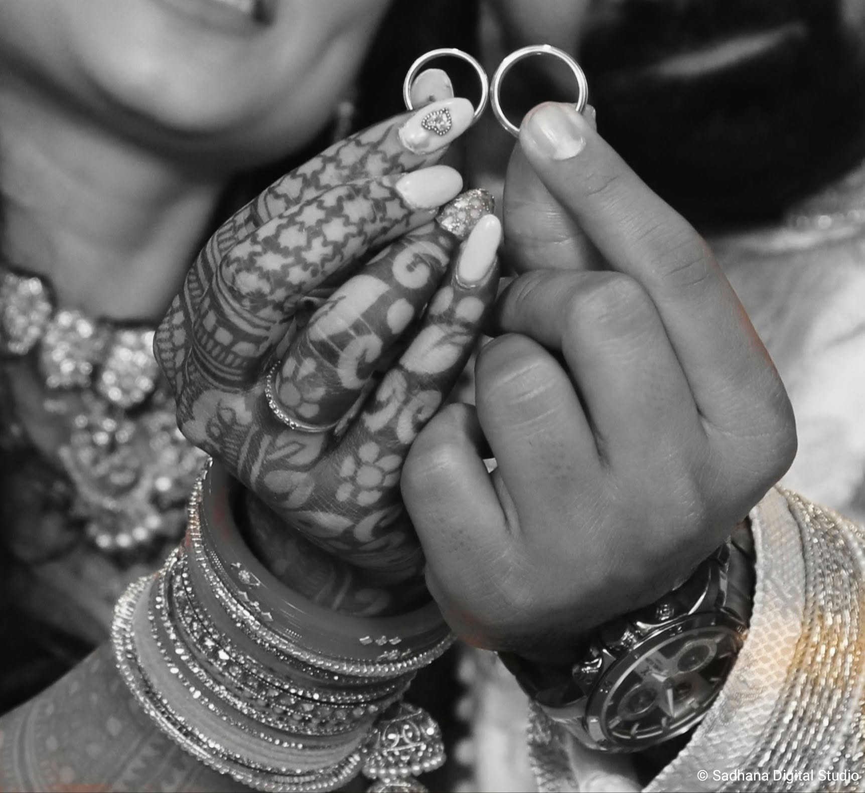 Bride laughing in red bridal attire