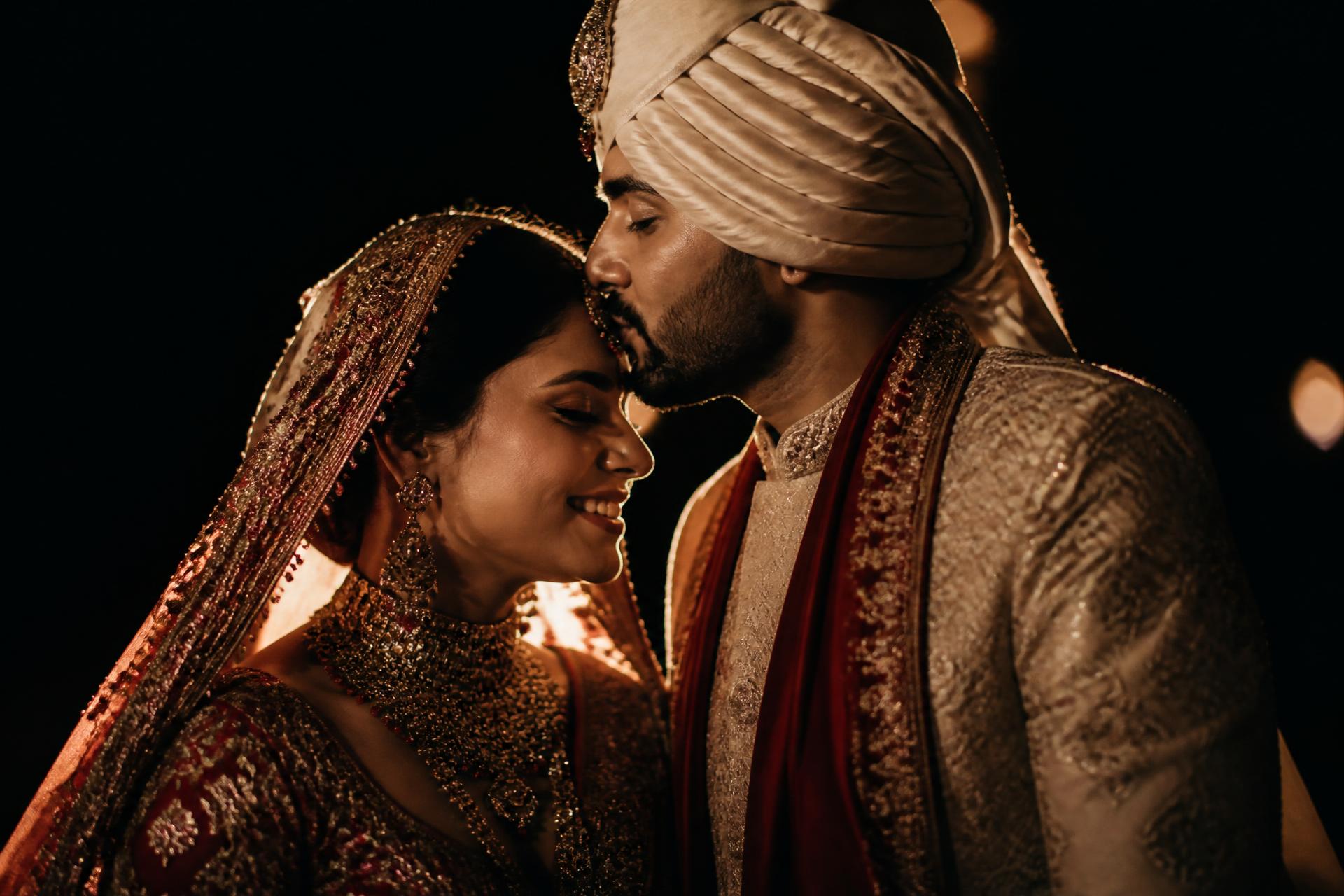 Intimate candid moment between bride and groom